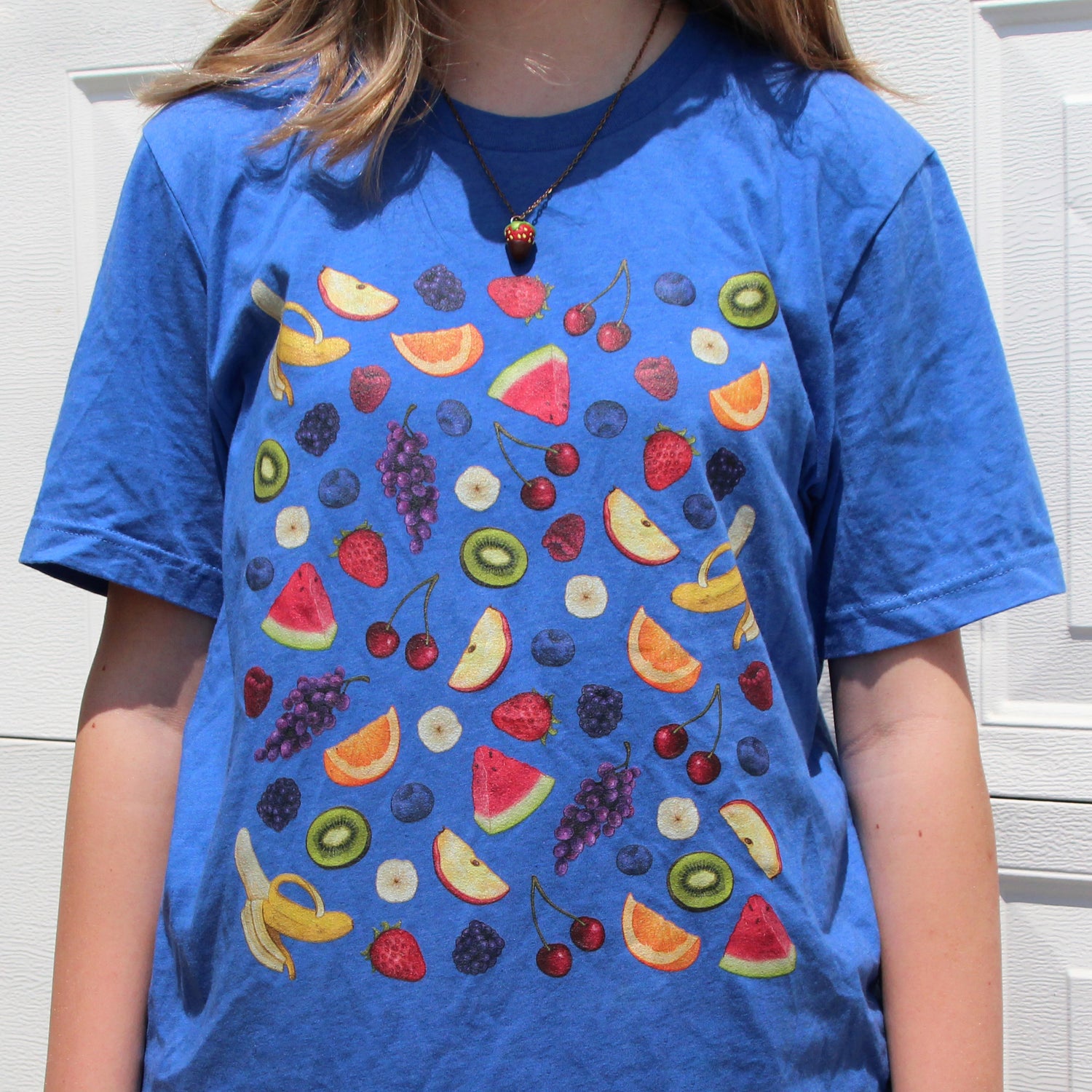 The "fruit salad" t-shirt in a blue color.