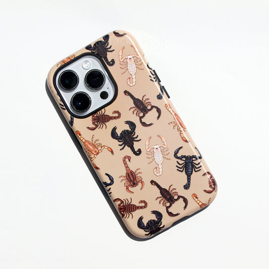 A tan-colored phone case featuring a pattern of various scorpions. There are brown, white, and black scorpions depicted.