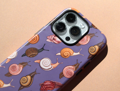 A closeup of the details on the snail-patterned phone case.