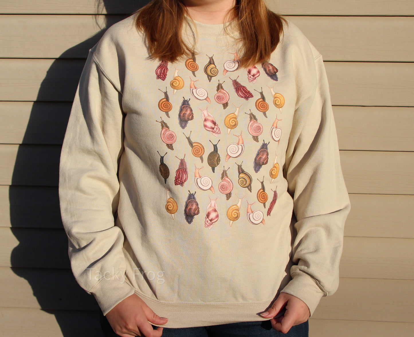 Another look at the sand-colored snails sweatshirt while warm sunset light shines on it.