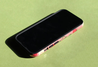 The roses tough phone case screen-side up. The inner layer of the phone case is solid black.