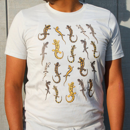 A man wearing a light grey t-shirt featuring a design of various salamanders. More specifically, this is the "silver" color variant of the shirt.