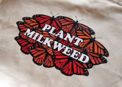A closeup of the print on the plant milkweed tote bag. The print is only on one side of the tote bag.