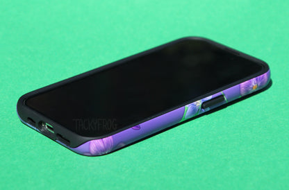 The violet phone case shown screen-side up. The inner black layer is visible around the openings and buttons.