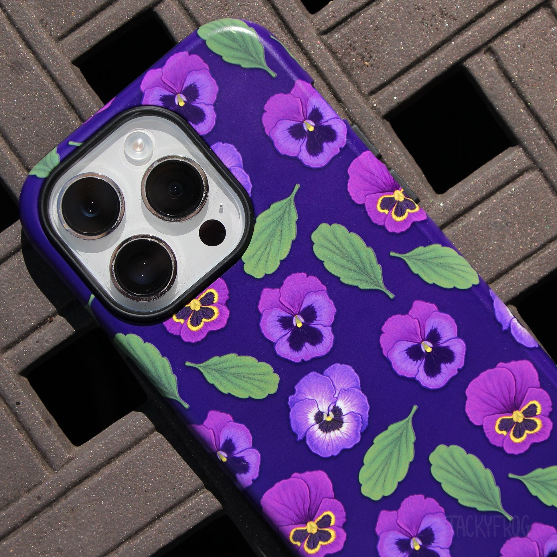 A close up of the details on the purple pansies phone case.