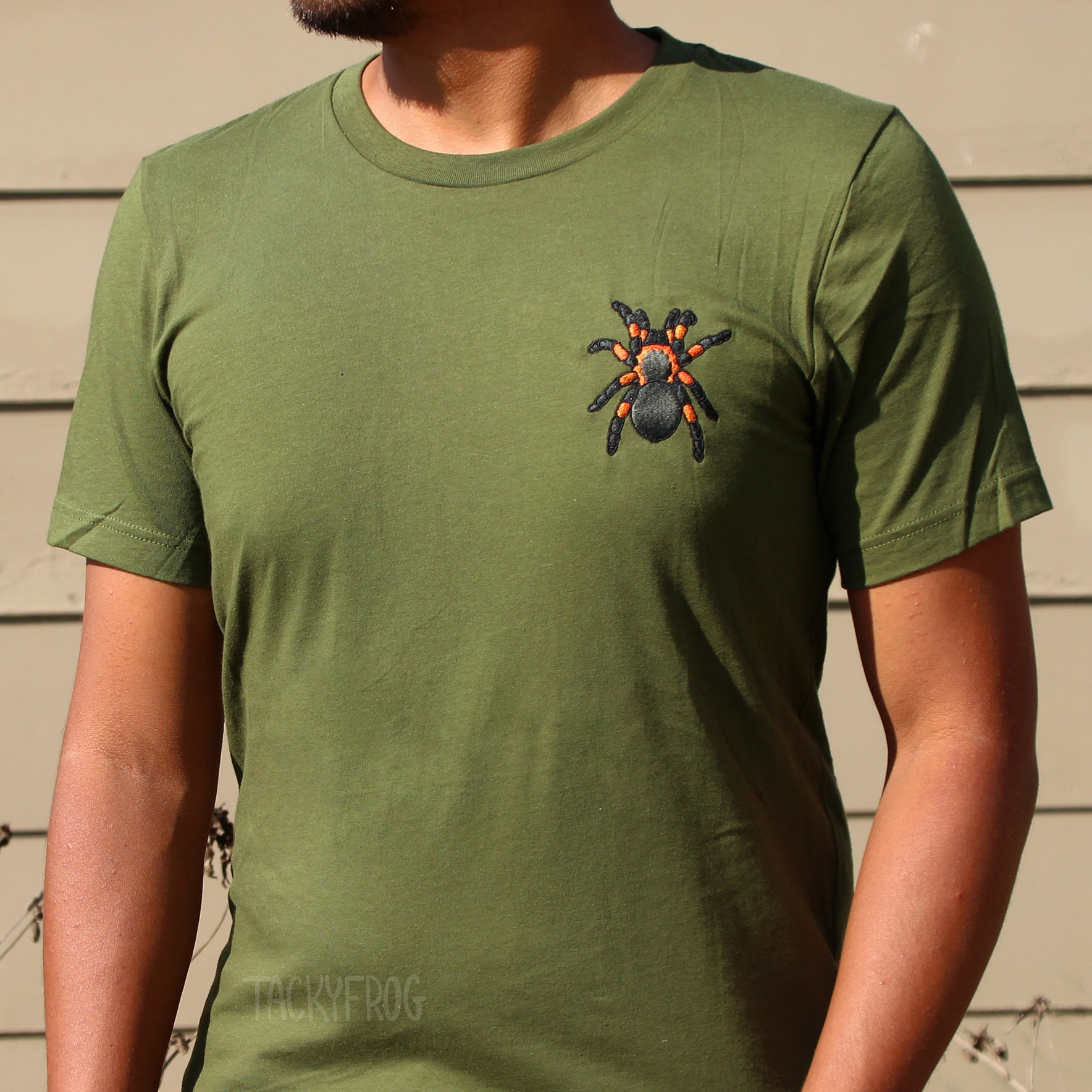 Another view of the olive-colored red-knee tarantula embroidered shirt.