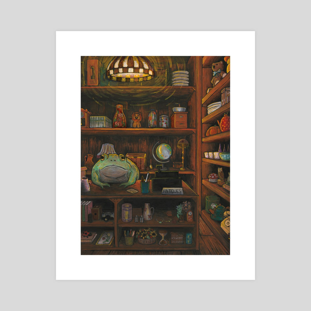 An art print depicting a frog at a desk in an antique store.