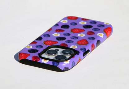 An angled view of the berry-patterned phone case. The inner layer of the case is solid black. It is visible around openings and buttons.