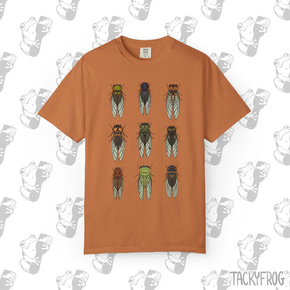 A t-shirt with nine different cicada designs in the color "Yam".