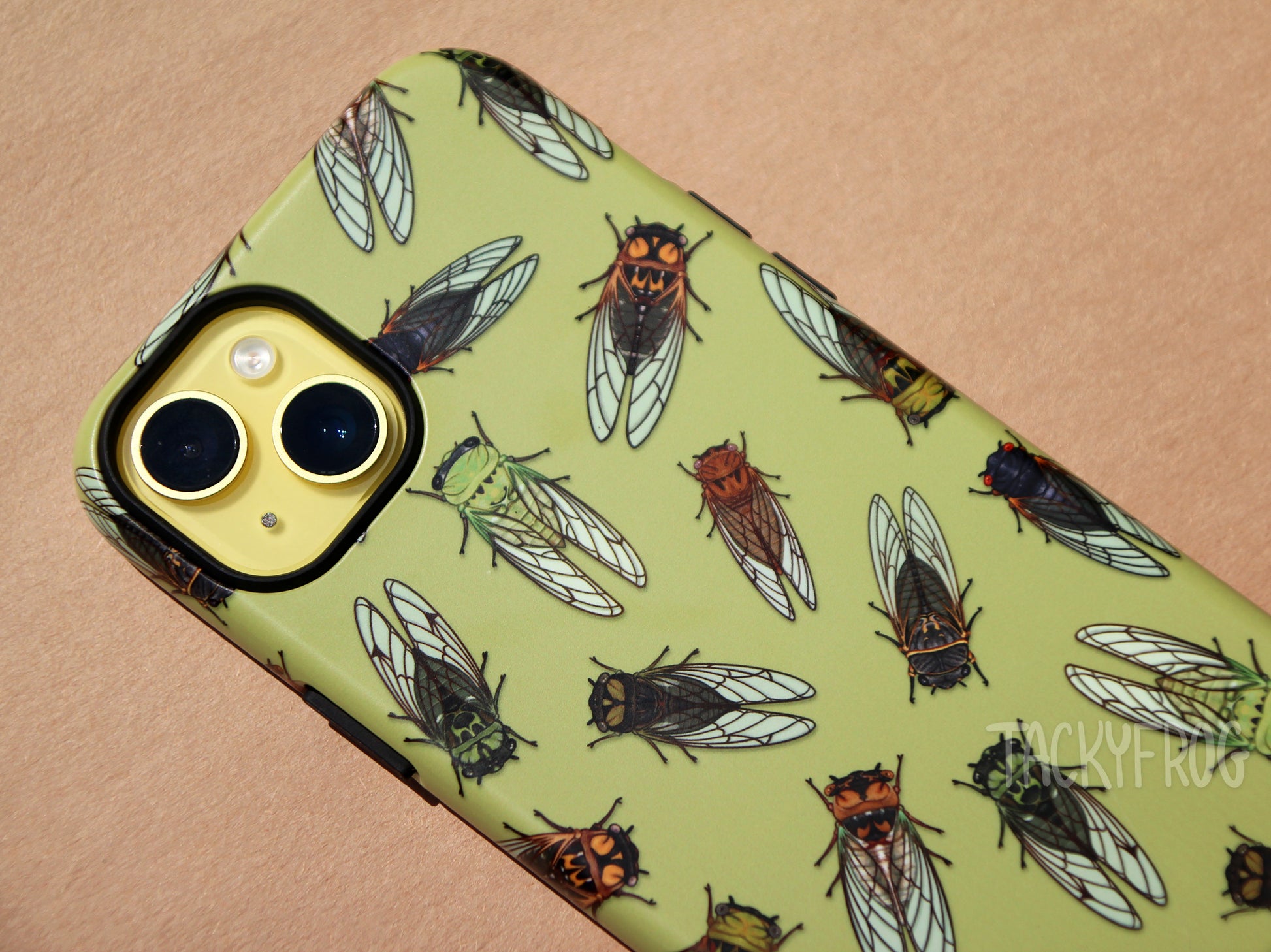 A close up of the details on the cicada case. The case has two layers. The inner layer of the case is solid black and visible around buttons and openings.