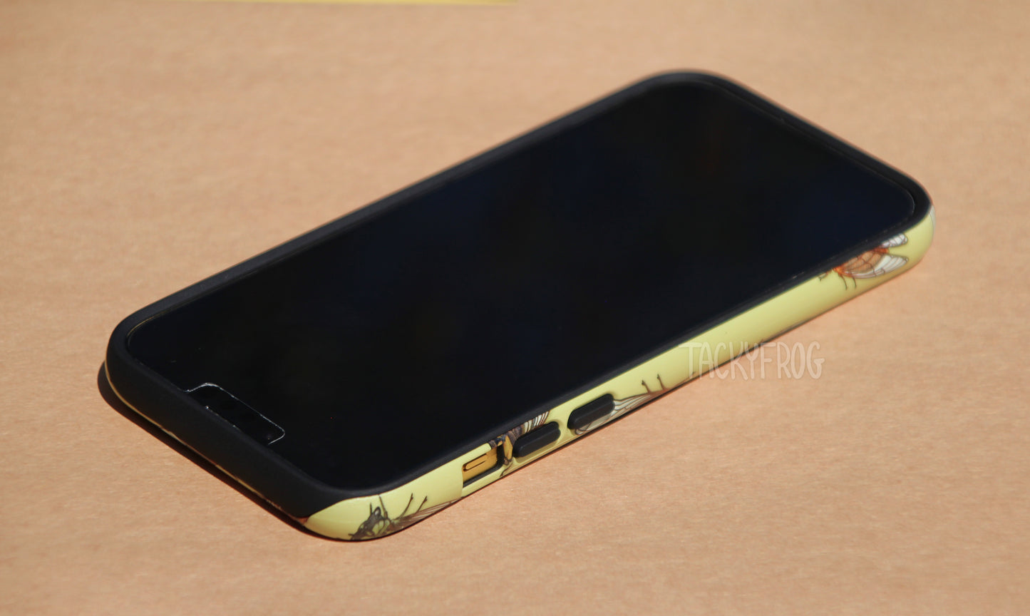 The cicada-patterned phone case shown screen side up.