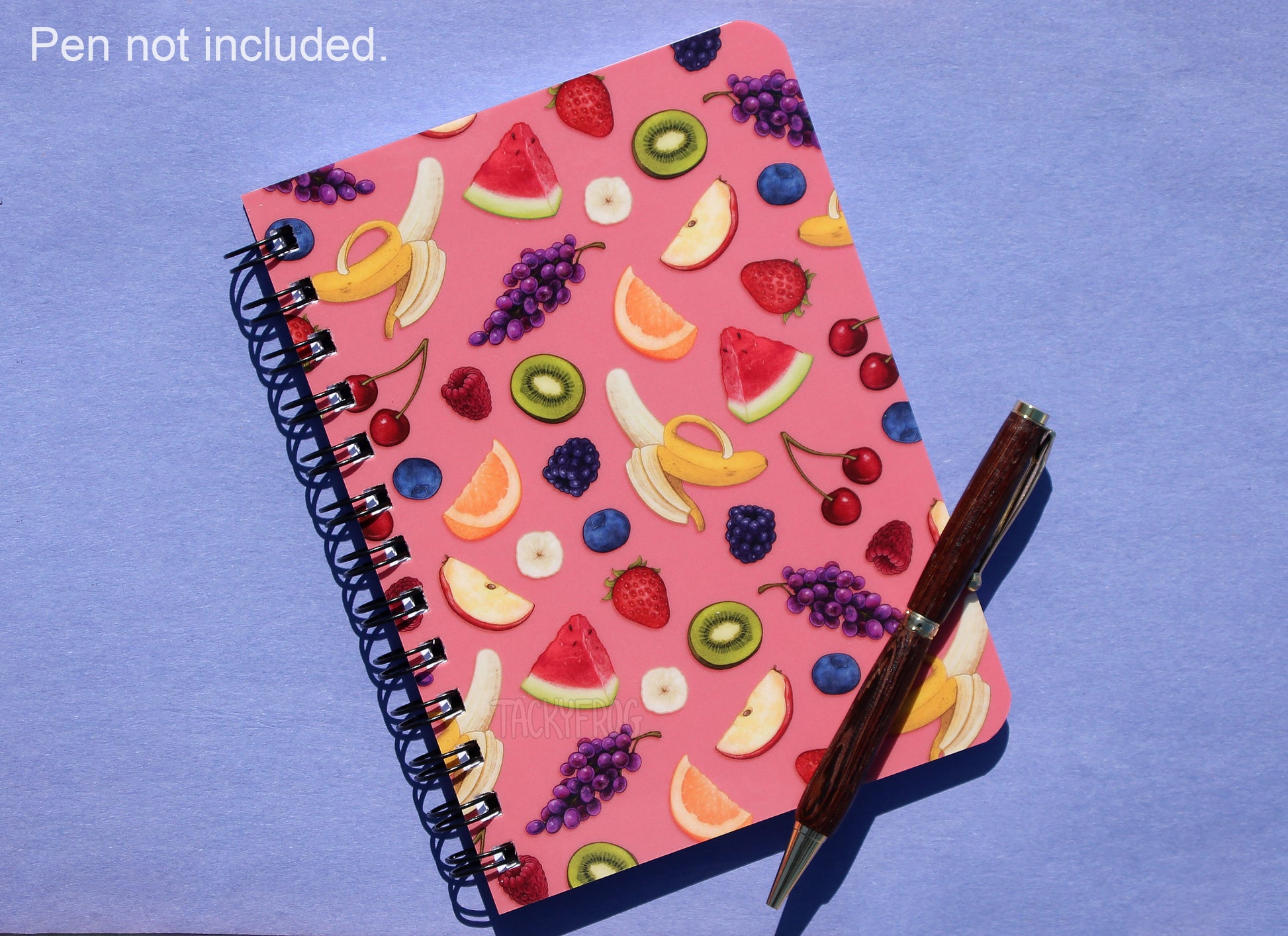 Another image of the fruit patterned journal. The text in the upper left corner reminds the viewer that the pen is not included.