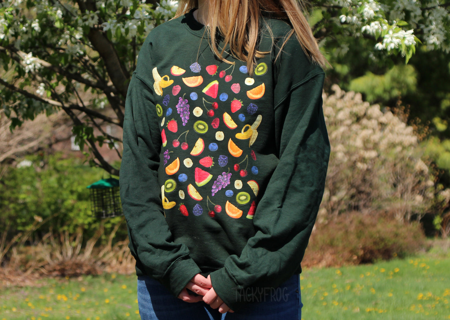 Another view of the fruit salad sweatshirt in the color "forest green".