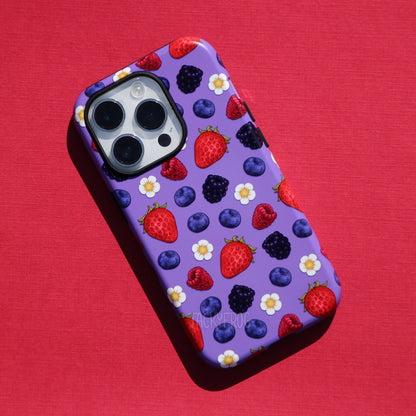 A purple phone case featuring a pattern of raspberries, strawberries, blackberries, blueberries, and white flowers.
