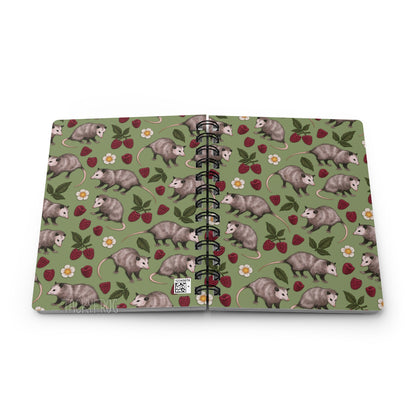 A mockup of the opossum notebook, shown open and face down so that the front and back covers are visible.