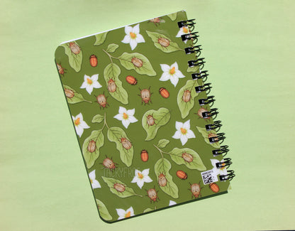 The back cover of the potato beetle spiral journal. Note that there is a small QR code in the lower right corner of the back cover.