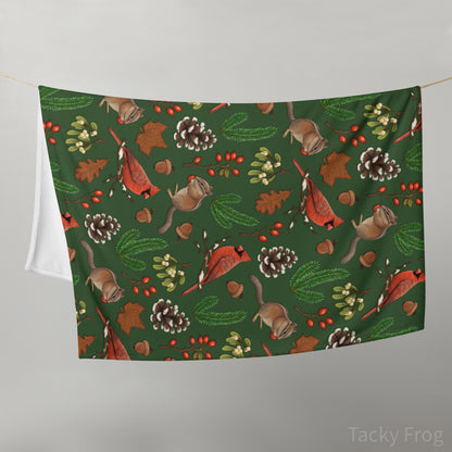 A mockup of the winter foraging blanket folded over a clothesline.