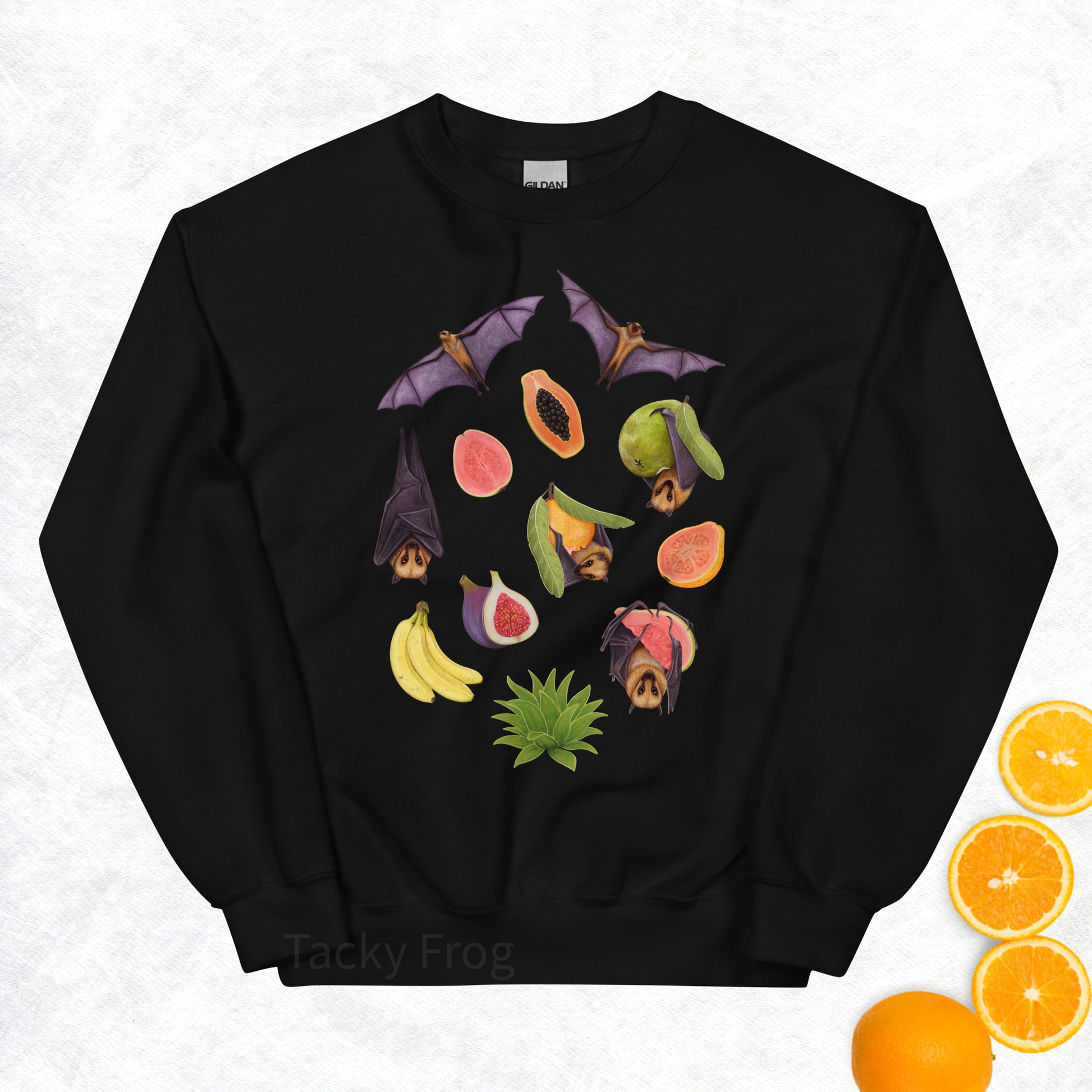 A mockup of the fruit bat sweatshirt in the color Black. The mockup is surrounded by fruit.