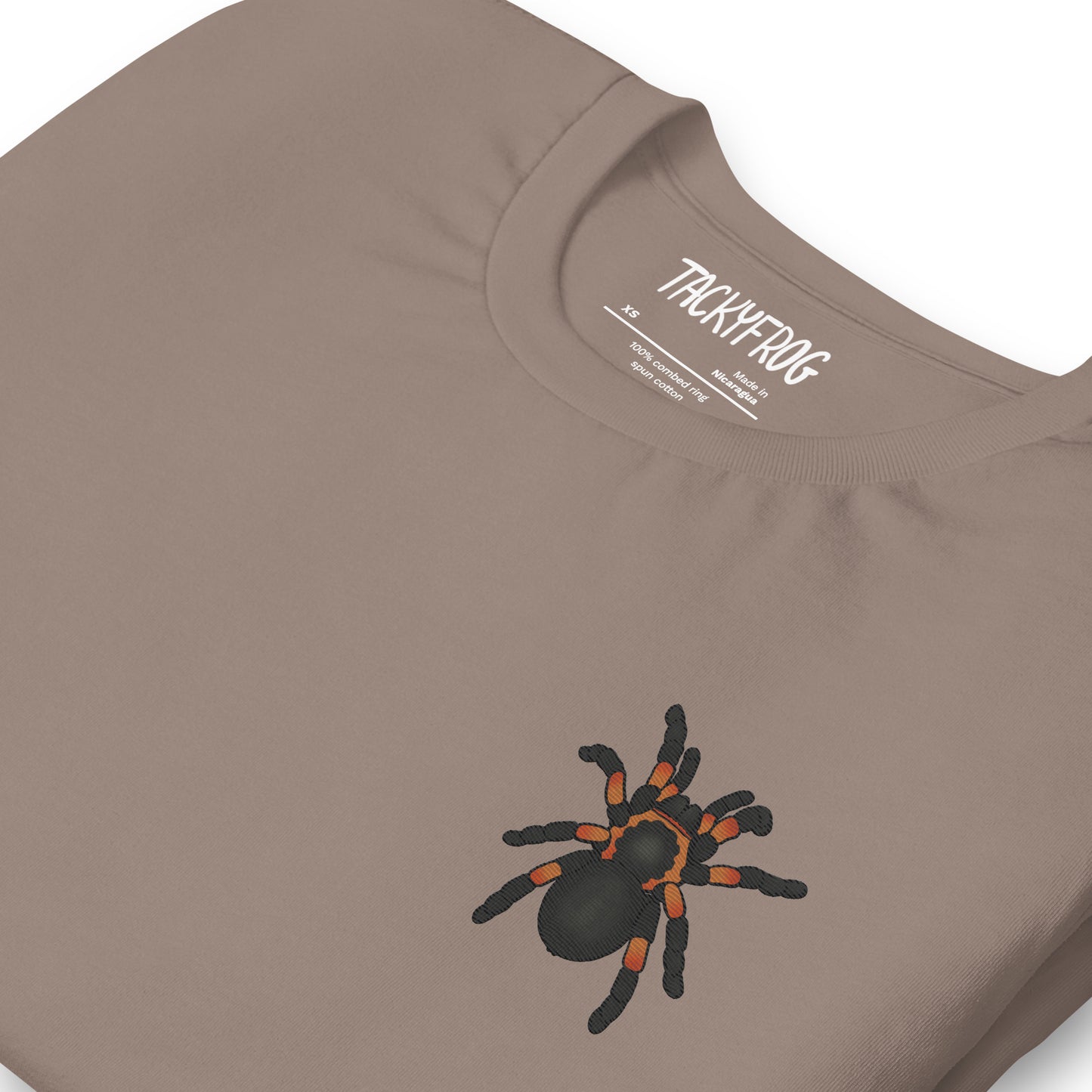 A mockup of the tarantula embroidered shirt in the color "pebble".