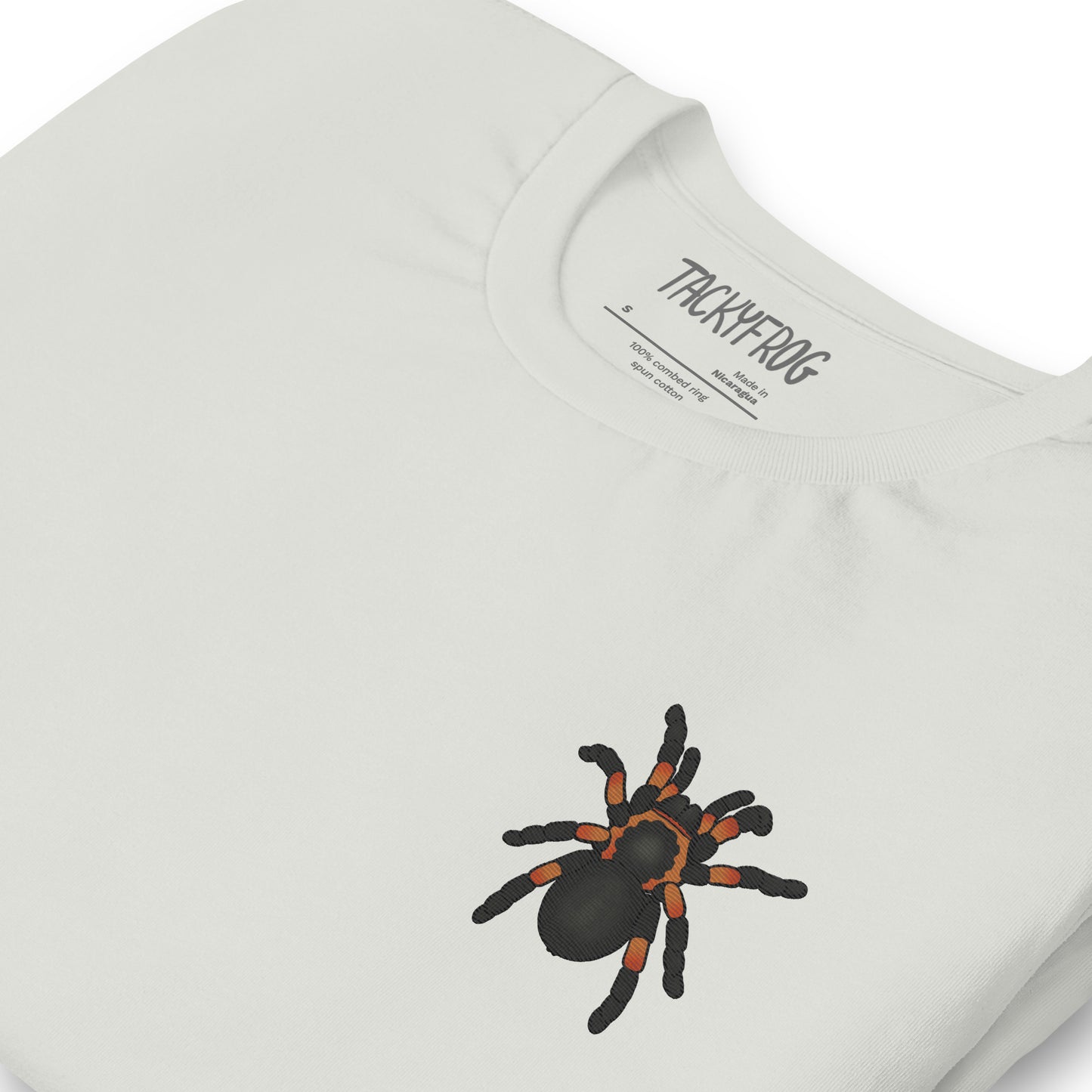 A mockup of the tarantula embroidered shirt in the color "silver".