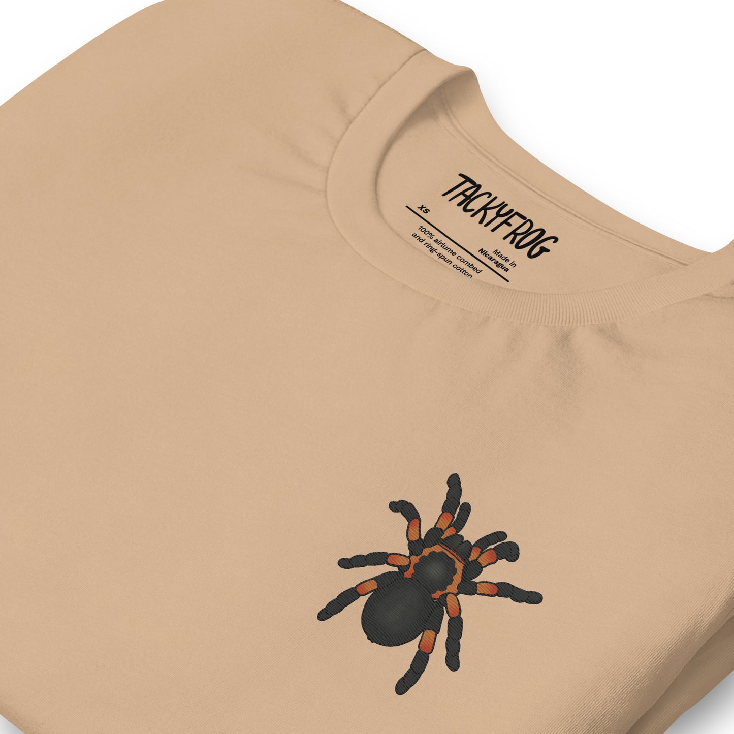 A mockup of the tarantula embroidered shirt in the color "tan".