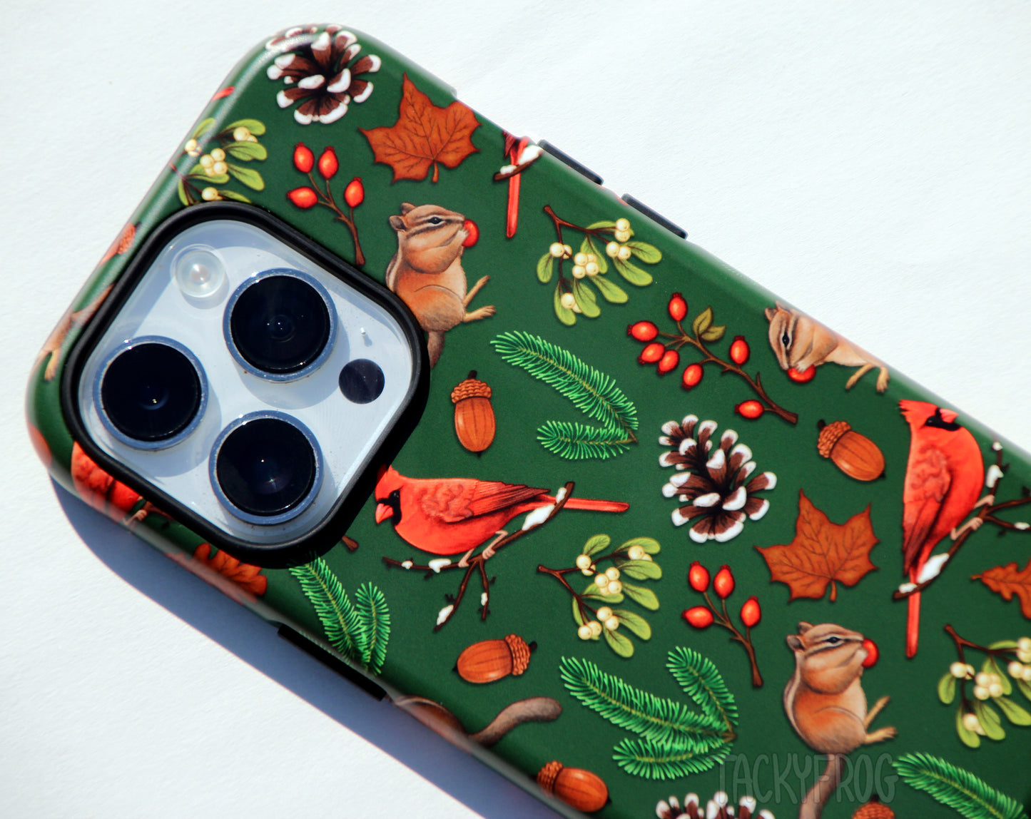 A close up of the pattern on the winter hike-inspired phone case. The inner layer of the case is solid black. It is visible around buttons and openings.