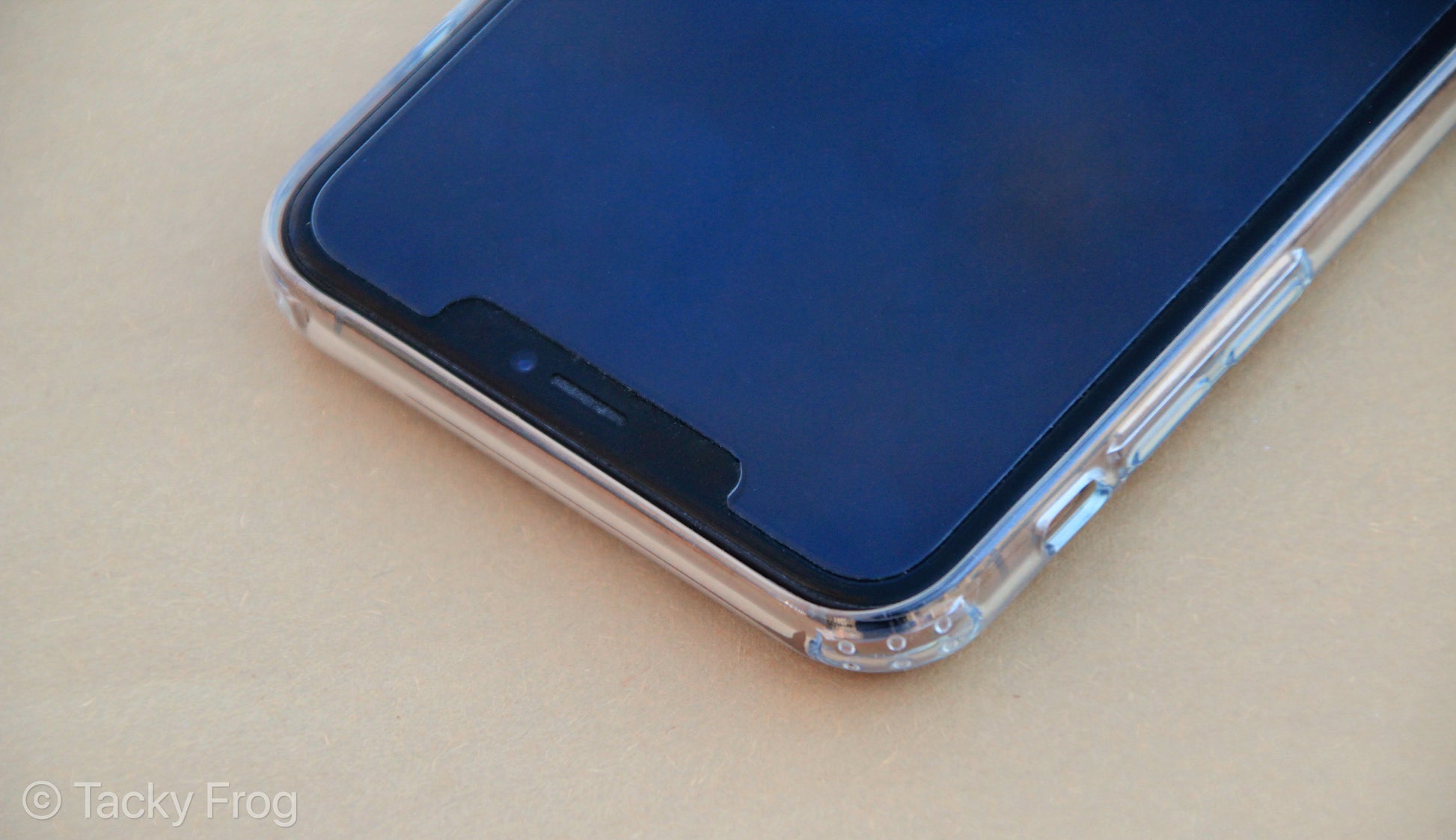 The clear phone case shown on an iPhone, screen-side up.