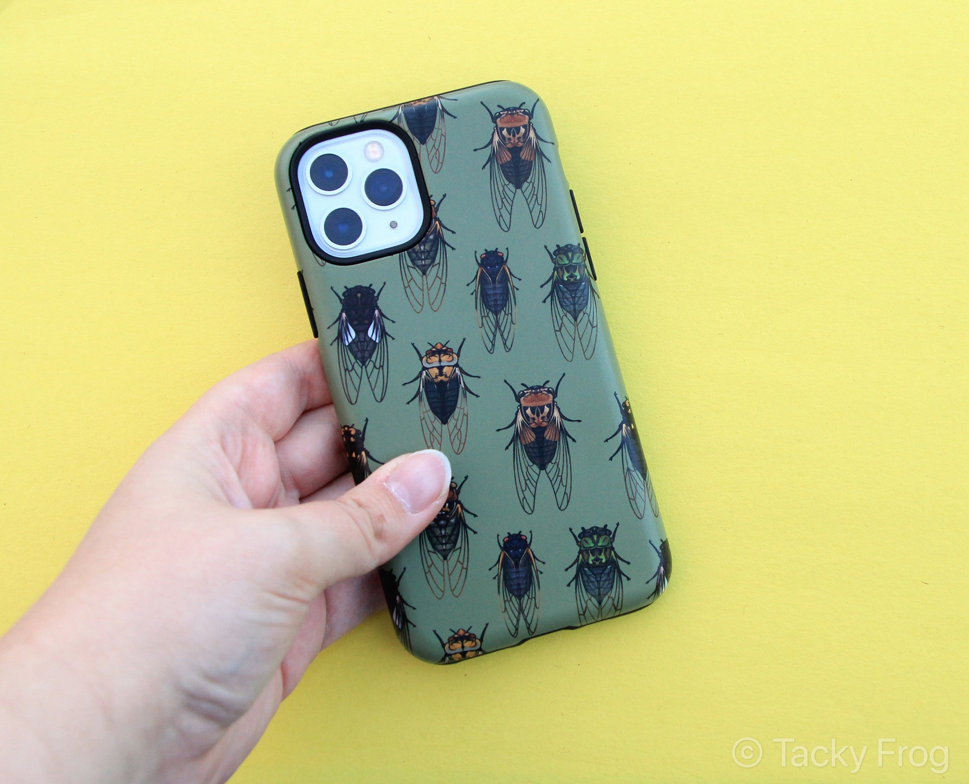 A green phone case with a cicada pattern on it.