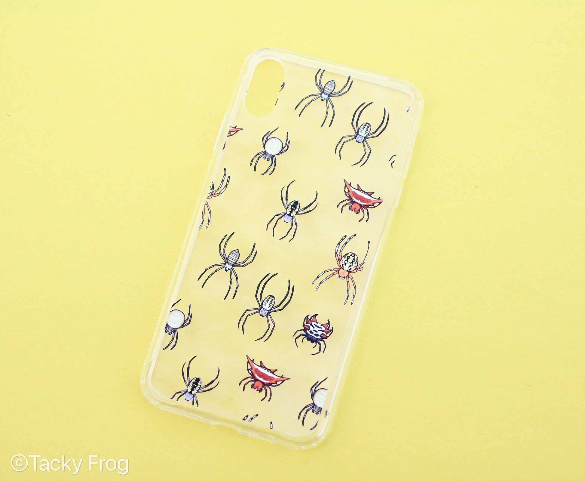 A clear phone case with a spider pattern design on it.