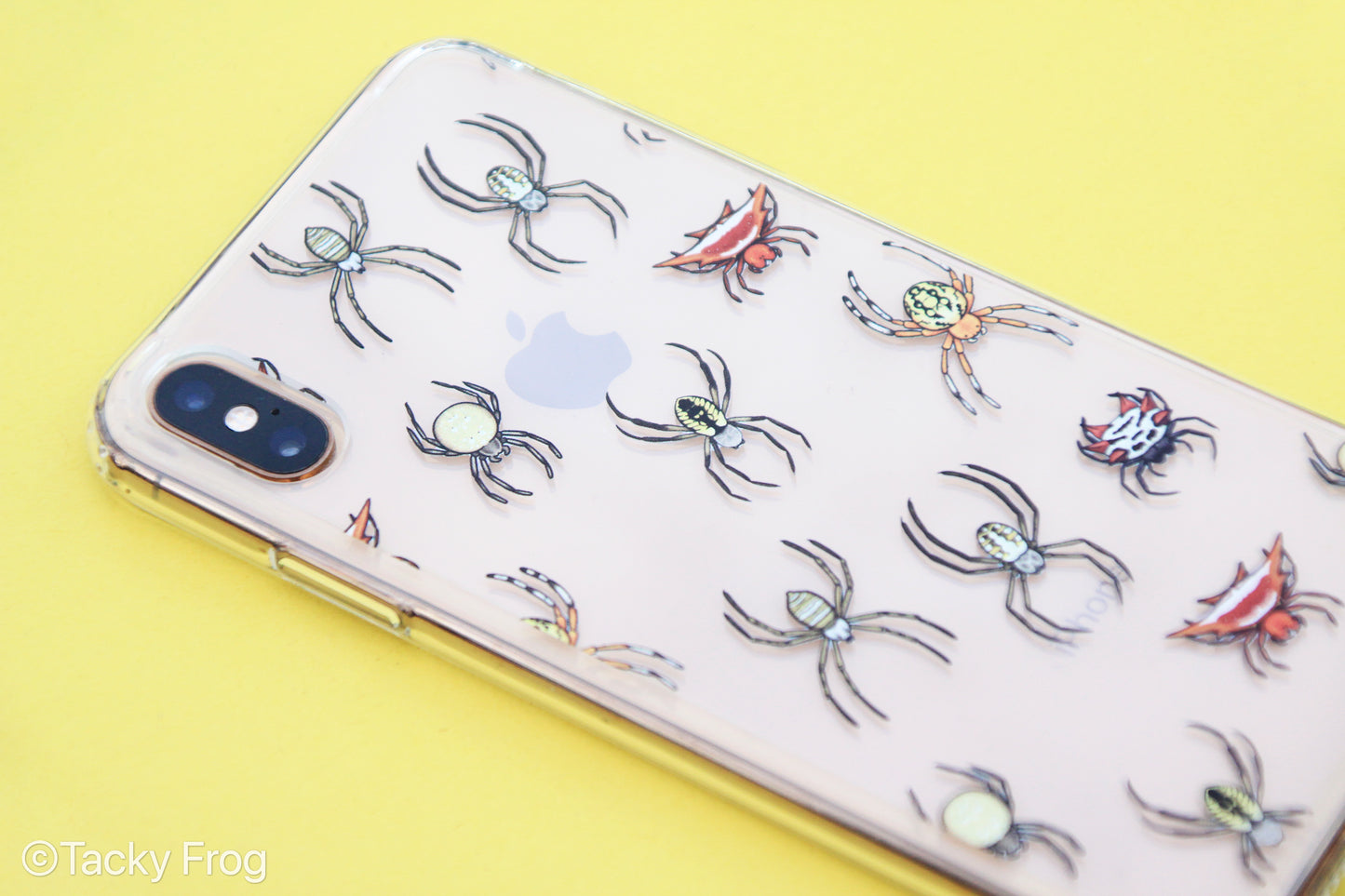 A clear phone case with a spider pattern on it.