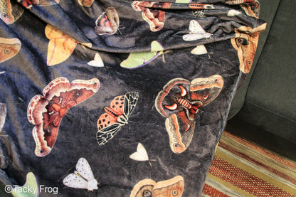 Details of the moths on the blanket.