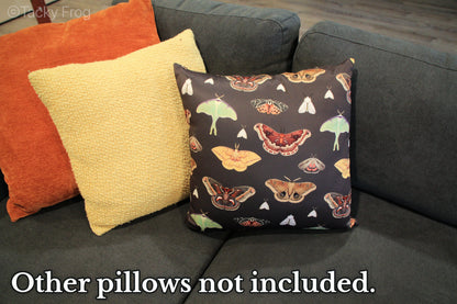 An example of the moth pillow with complimentary pillows. The text says, "other pillows not included".