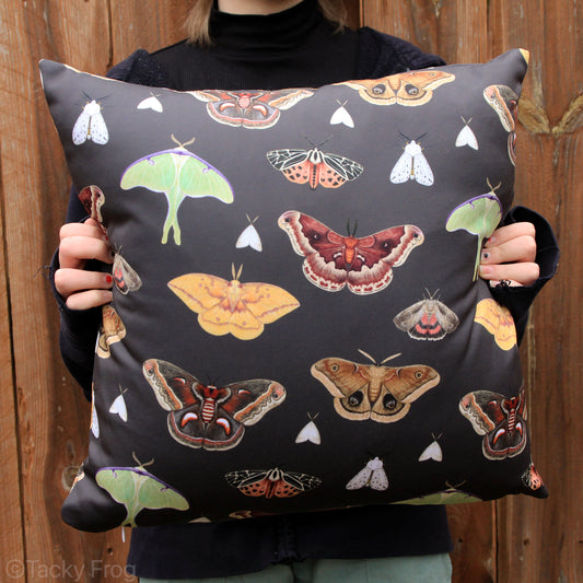 An 18 x 18 inch brown pillow featuring a moth pattern.