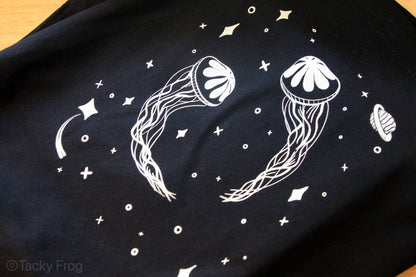 Close up of the space jellyfish design. A planet and stars are shown.