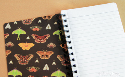 The inside covers of the notebook are patterned with moths as well.