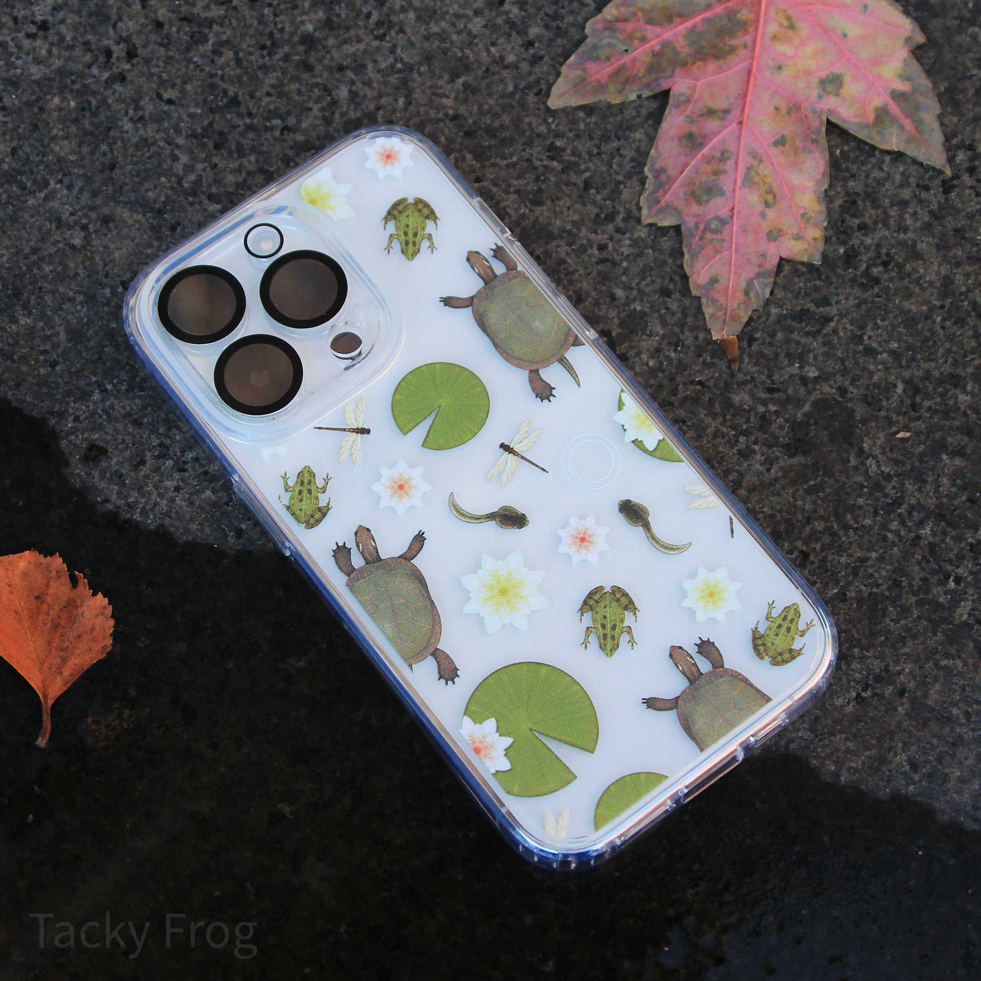 A clear phone case featuring pattern that depicts wildlife that can be found in freshwater ponds. The camera cover is not included.