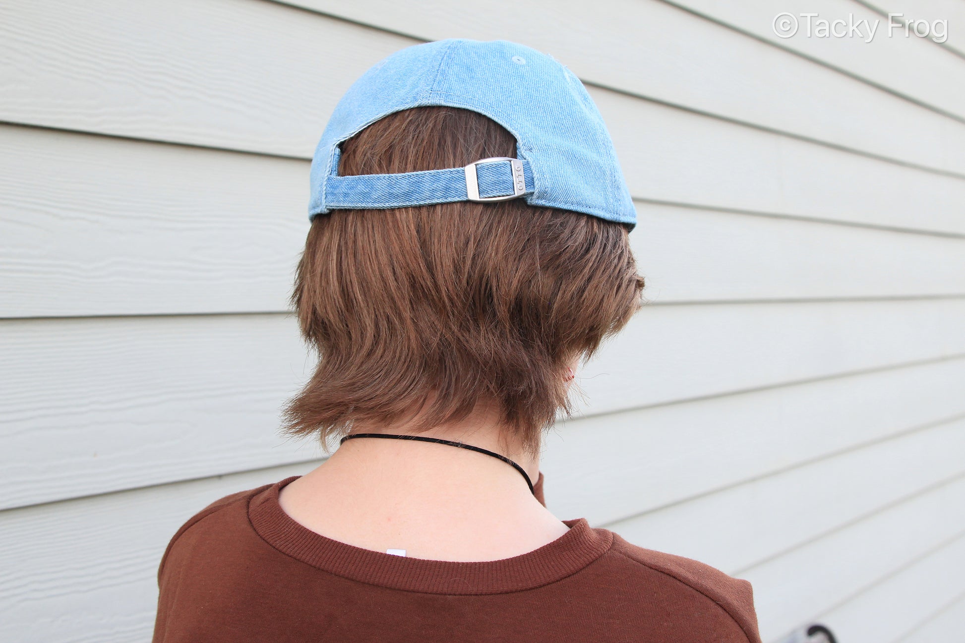 A photo showing the back (and buckle) of the Hercules beetle denim cap.