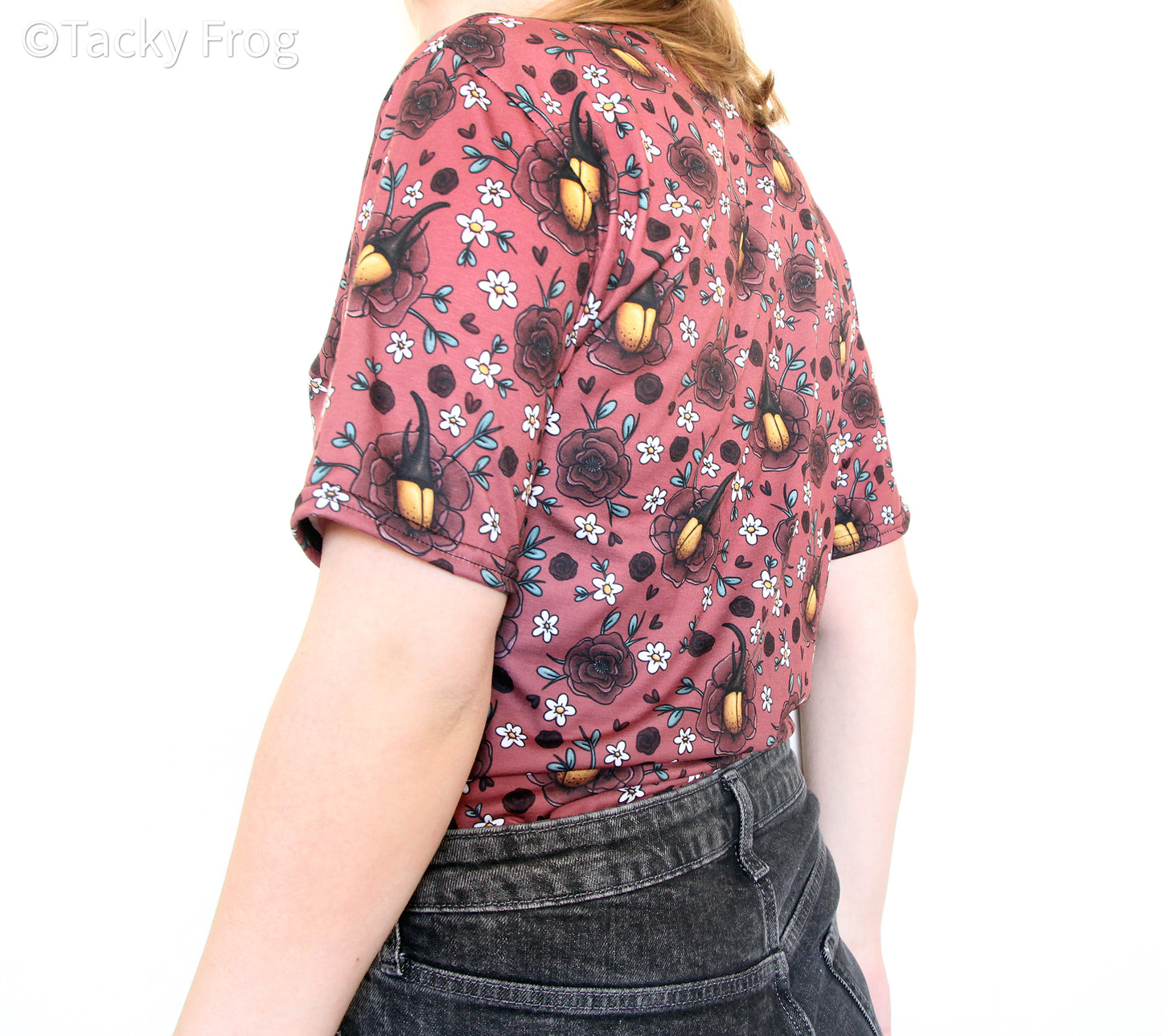 A side view of the Hercules beetle and florals unisex t-shirt.