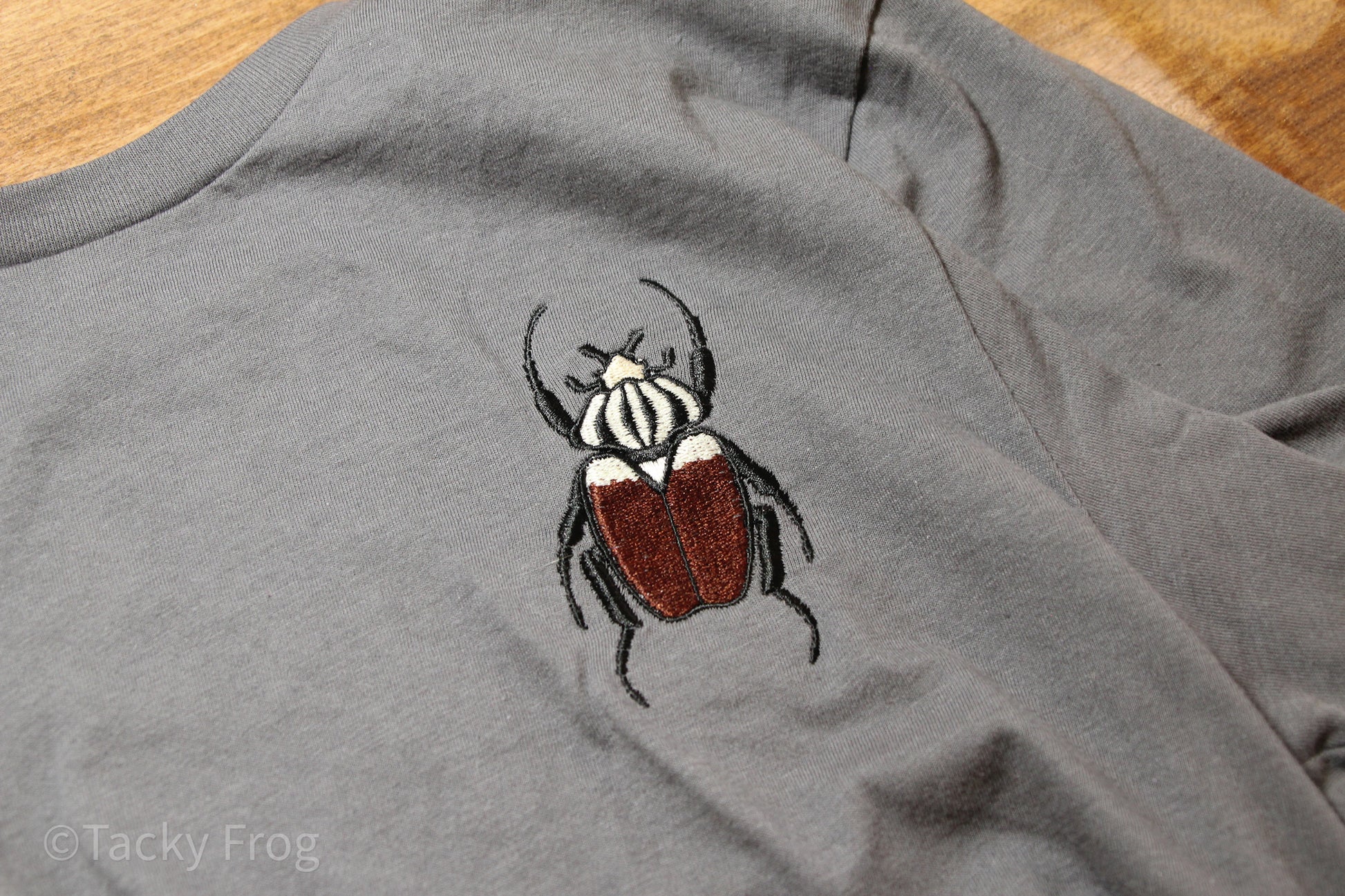 A close up of the Goliath beetle embroidery.