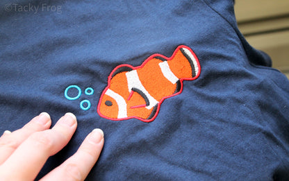 A close-up of the embroidery on the clown fish t-shirt.