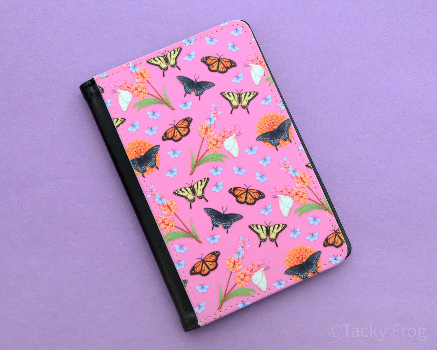 The butterfly garden-inspired passport wallet on its own.