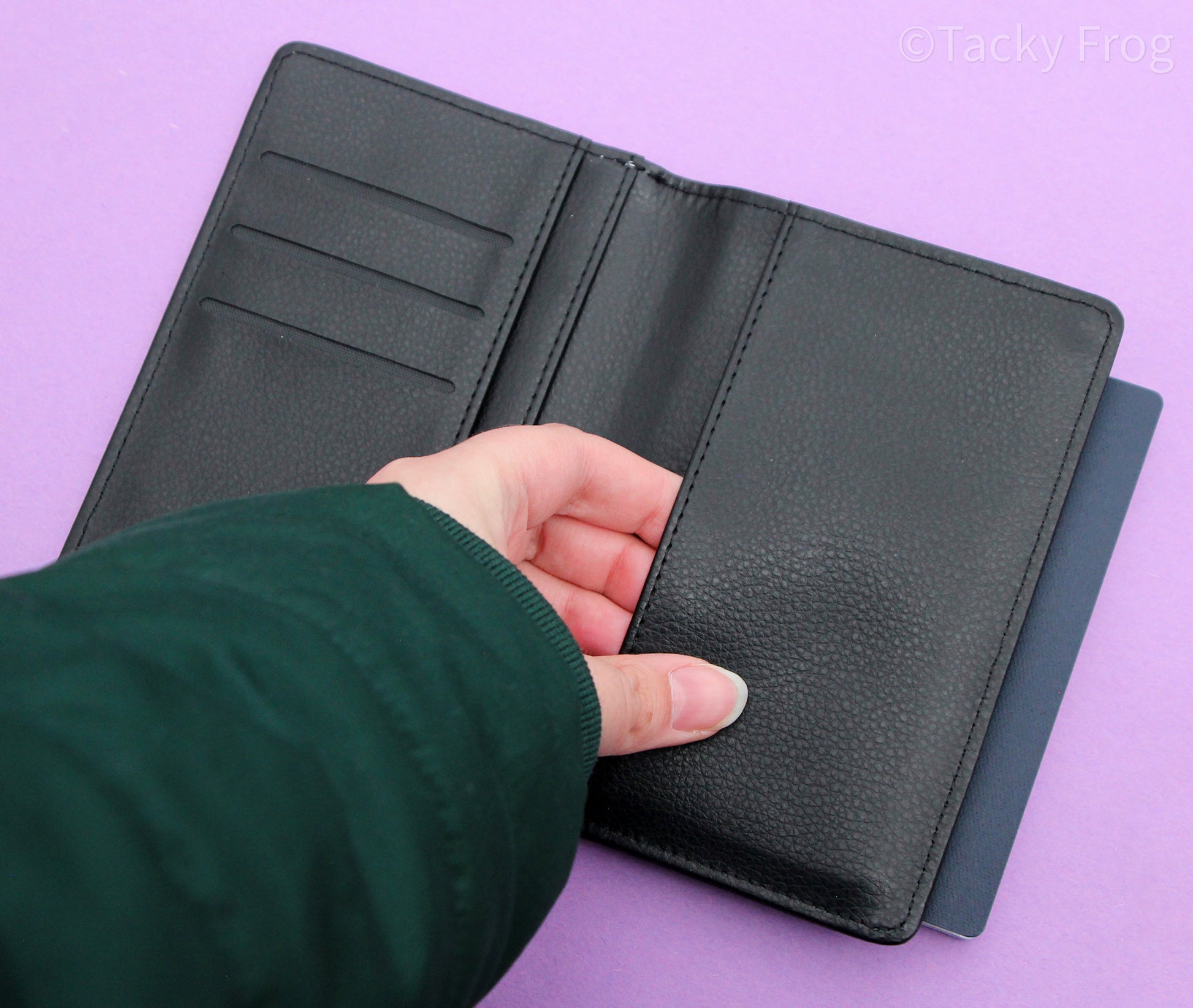 Showing the interior of the passport wallet, specifically focusing on the large passport-sized pocket.