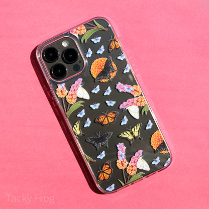 A clear phone case featuring a butterfly garden-inspired pattern on it. The pattern features depictions of butterfly bushes, orange dahlias, monarch butterflies, swallowtail butterflies, and a couple other butterflies.