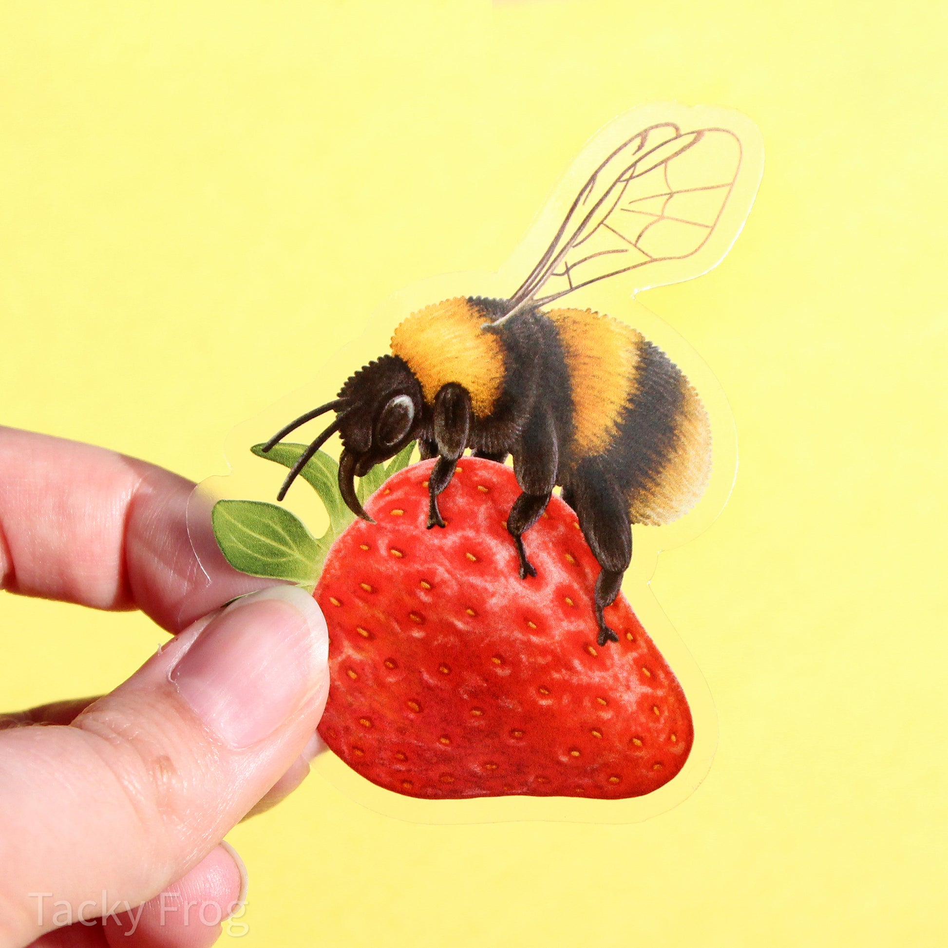 Another view of the bumblebee on a strawberry sticker.