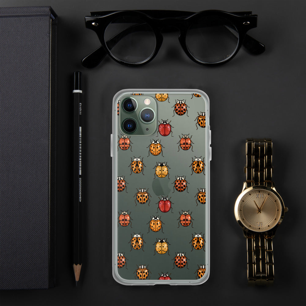 A mockup of a clear phone case with a ladybug pattern on it. It is shown on an iPhone.