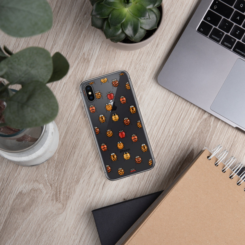 A mockup of a clear phone case with a ladybug pattern on it. It is shown on an iPhone.