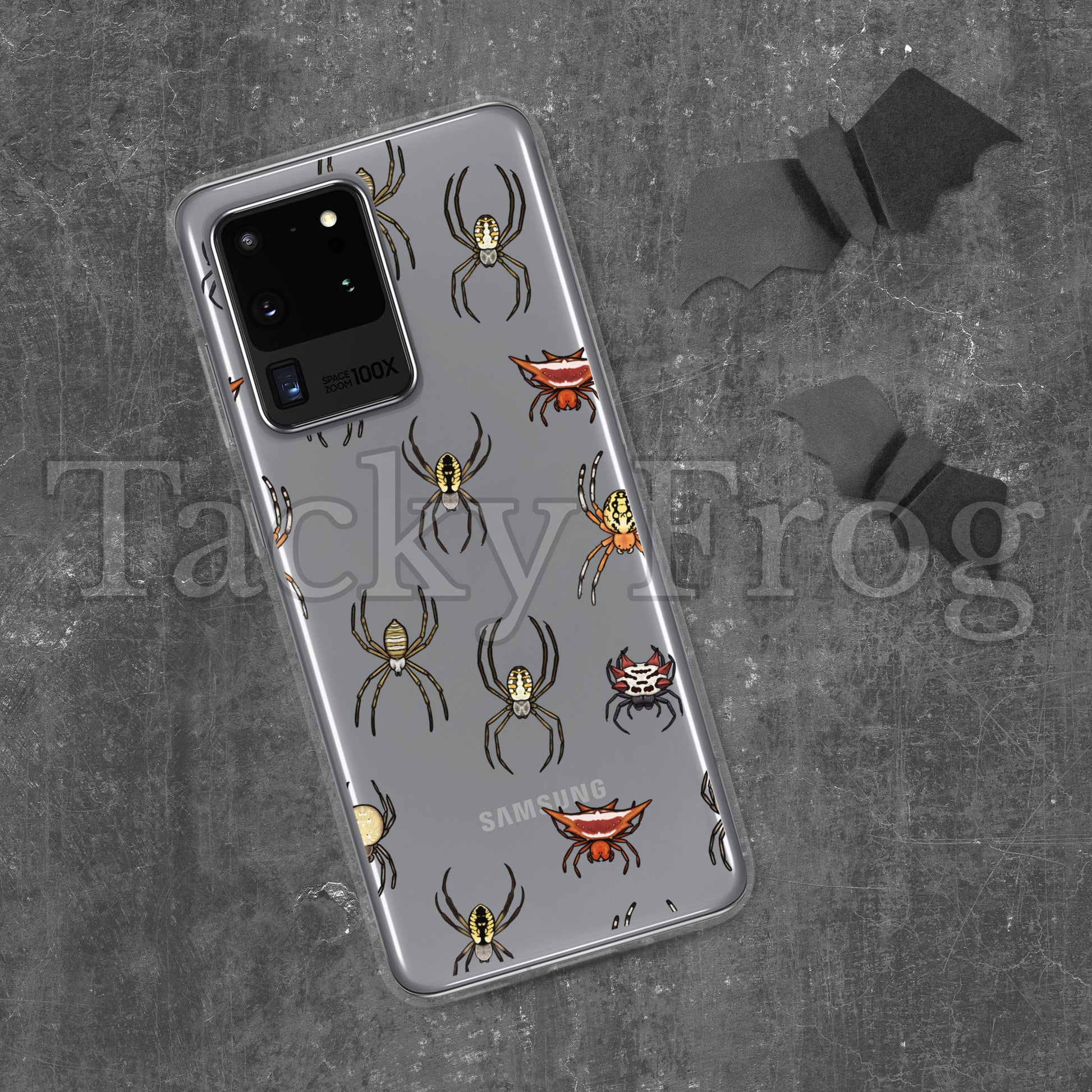 A mockup of a spider pattern clear phone case, shown on a Samsung Galaxy.