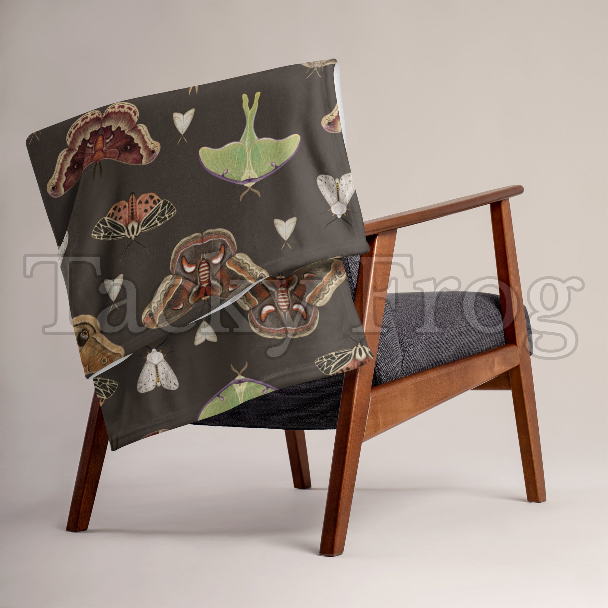 A mockup of the brown moth blanket hung over a chair.