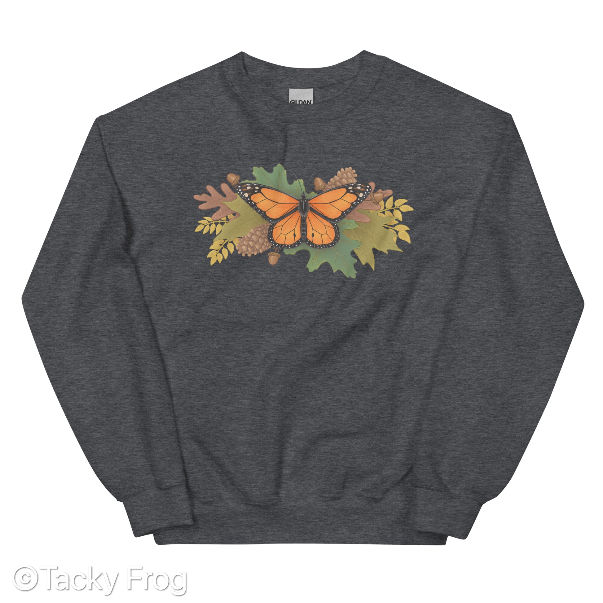 A mockup of a dark heather grey sweatshirt with a monarch butterfly and autumn leaves on it.