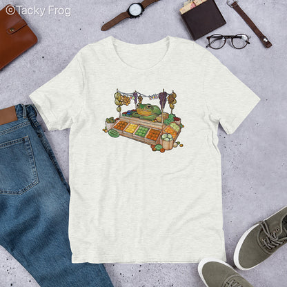 A mockup of the fruit vendor frog shirt in the color Ash.